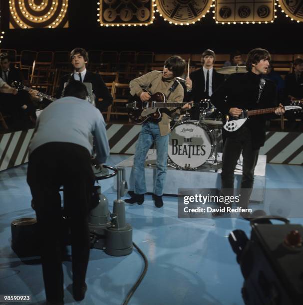 From left, Paul McCartney , George Harrison , Ringo Starr and John Lennon , of English rock and pop group The Beatles perform together on stage...