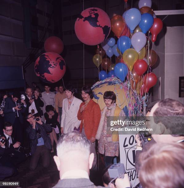 From left, Paul McCartney, George Harrison and Ringo Starr of English rock and pop group The Beatles pose together during a press call to promote...