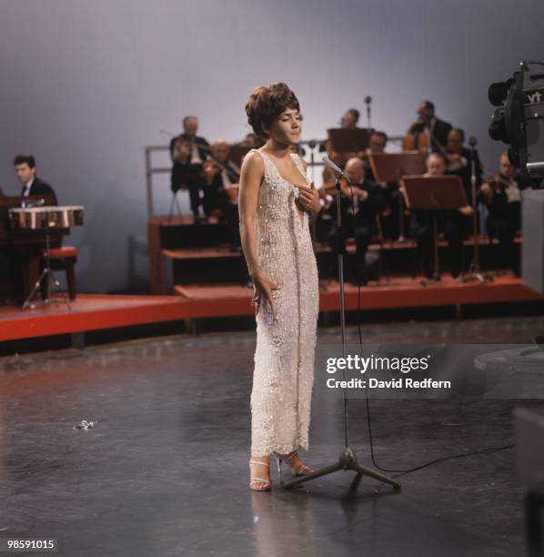 Welsh singer Shirley Bassey performs live on a television show in London circa 1965.
