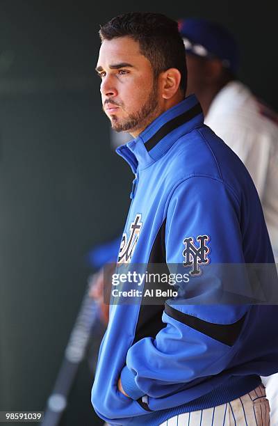 Oliver Perez of the New York Mets looks on in the dugout after being pulled in the fifth inning against the Washington Nationals during their game on...