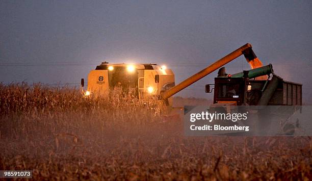 New Holland Agriculture combine harvests corn in Ines Indart, Agentina, on Monday, April 5, 2010. Before April 20, corn declined 14 percent this year...