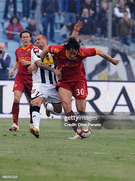 Simone Pepe of Udinese competes with Luca Toni of Roma during the Tim Cup between Udinese Calcio and AS Roma at Stadio Friuli on April 21, 2010 in...