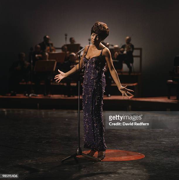 Welsh singer Shirley Bassey performs on a television show in London circa 1965.