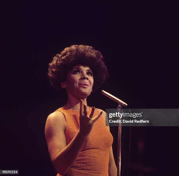 Welsh singer Shirley Bassey performs live on stage in November 1976.