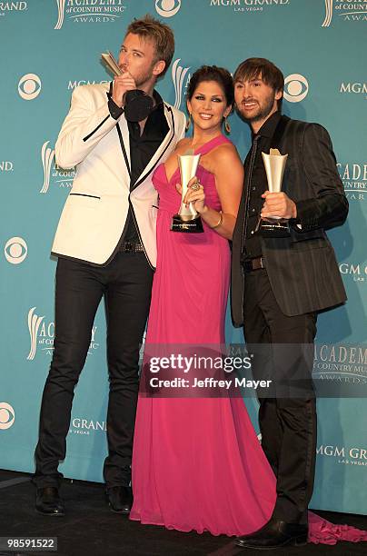 Musician Charles Kelley, singers Hillary Scott and Dave Haywood of the band Lady Antebellum winner of Song of the Year pose in the press room during...