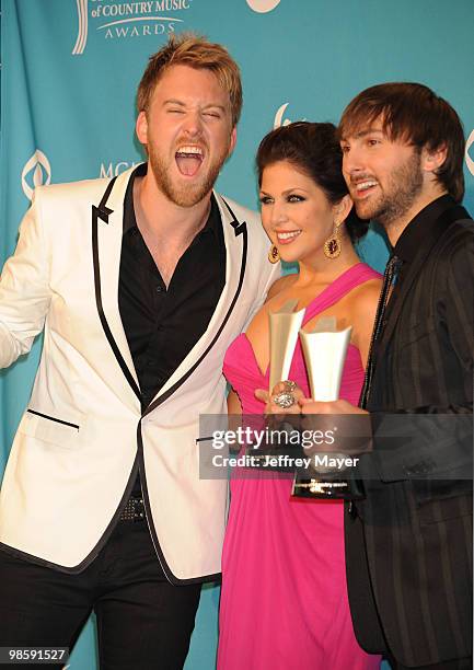 Musician Charles Kelley, singers Hillary Scott and Dave Haywood of the band Lady Antebellum winner of Song of the Year pose in the press room during...
