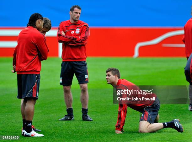 Steven Gerrard, Glen Johnson and Jamie Carragher of Liverpool attend a training session ahead of the UEFA Europa League semi-final first leg match...