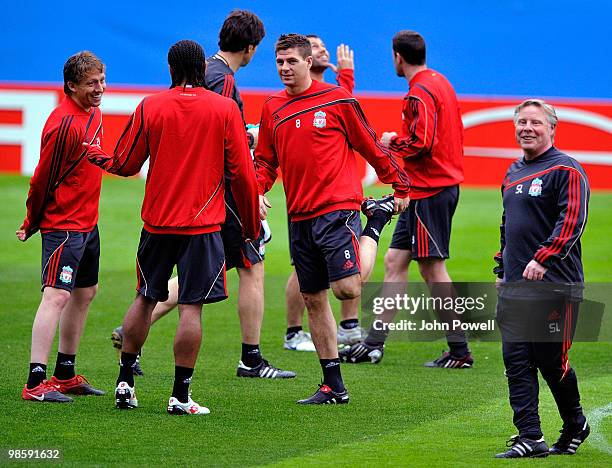 Steven Gerrard, Glen Johnson and Lucas Leiva of Liverpool and assistant manager Sammy Lee attend a training session ahead of the UEFA Europa League...