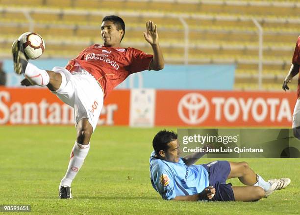 Johnny Lalopu of Juan Aurich and Wilians Ferreira from Bolivar vie for the ball during a match of the Libertadores Cupat Hernando Siles Stadium on...