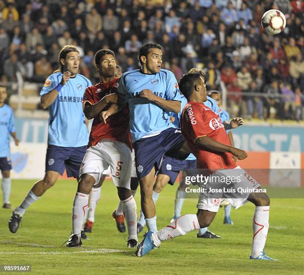 Players from Bolivar and Juan Aurich struggle for the ball during a matcha as part of Libertadores Cup in Hernando Siles Stadium on Abril 20, 2010 in...