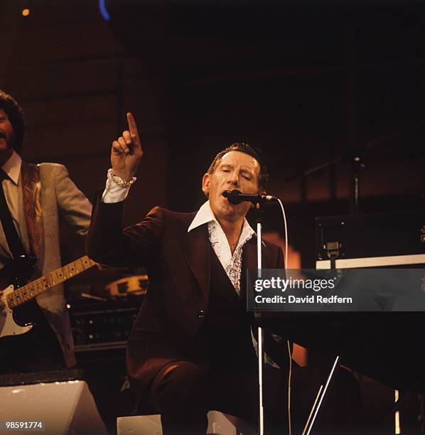 Jerry Lee Lewis performs on stage at the Country Music Festival held at Wembley Arena, London in April 1987.