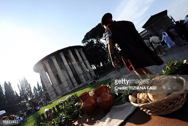 Man dressed up as an ancient Roman soldier walks near the Tempio di Vesta on April 21 in Rome during a ceremony to celebrate the anniversary of the...