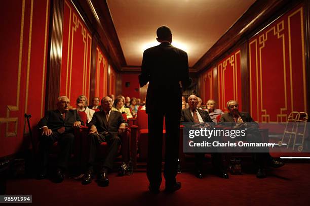 President Barack Obama behind the scenes at the White House in Washington, DC, on April 6, 2010. The president introduces a movie to guests,...