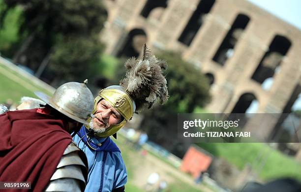 Two man dressed up as ancient Roman soldiers chat at the Circo Massimo on April 21, 2010 in Rome, during a ceremony to celebrate the anniversary of...