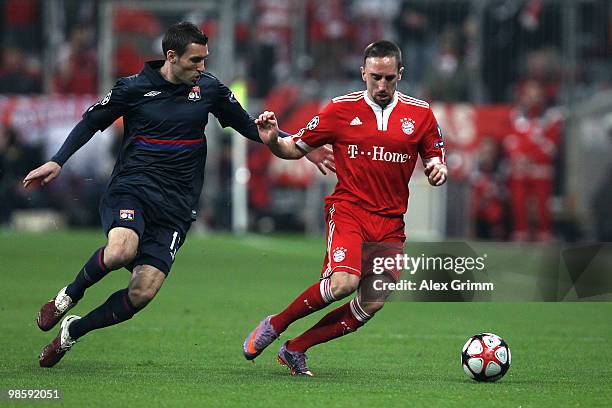 Franck Ribery of Bayern and Anthony Reveillere of Lyon battle for the ball during the UEFA Champions League semi final first leg match between FC...