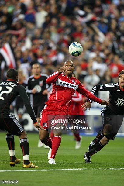 Collins John of Chicago Fire shoots against Rodney Wallace of D.C. United at RFK Stadium on April 17, 2010 in Washington, DC. The Fire won 2-0.