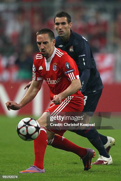 Franck Ribery of Bayern Muenchen battles for the ball with Anthony Reveillere of Lyon during the UEFA Champions League semi final first leg match...