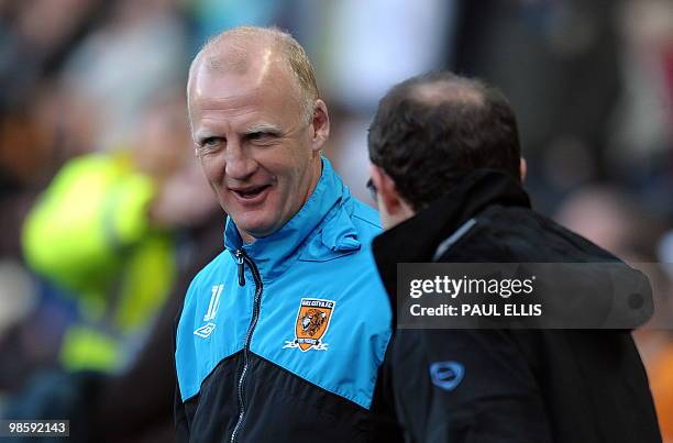 Hull City's caretaker manager Iain Dowie greets Aston Villa manager Martin O'Neill before their English Premier League football match at The KC...