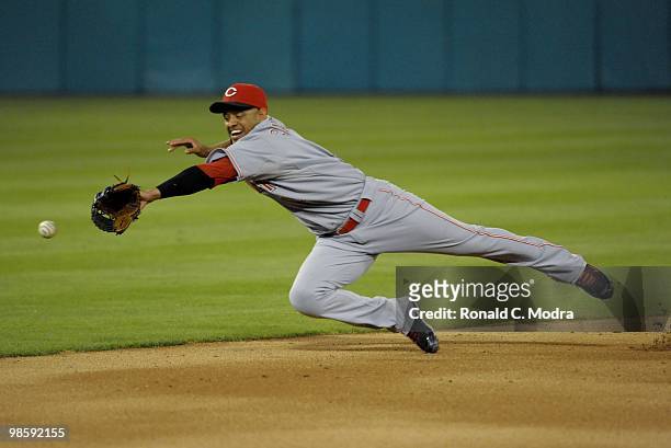 Orlando Cabrera of the Cincinnati Reds dives for a ball during a MLB game against the Florida Marlins at Sun Life Stadium on April 13, 2010 in Miami,...