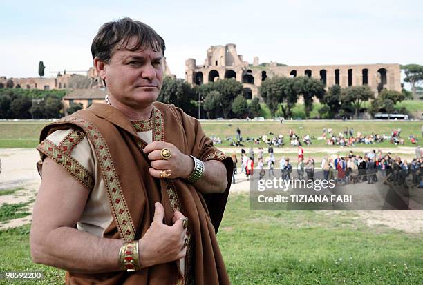 Man dressed up as an ancient Roman poses in front of the Circo Massimo on April 21, 2010 in Rome, during a ceremony to celebrate the anniversary of...