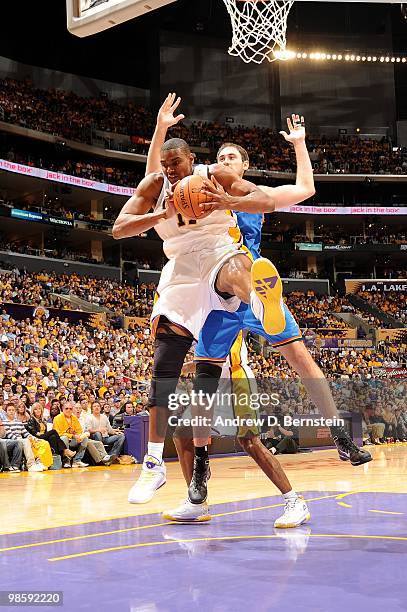 Andrew Bynum of the Los Angeles Lakers rebounds against Nenad Krstic of the Oklahoma City Thunder in Game One of the Western Conference Quarterfinals...