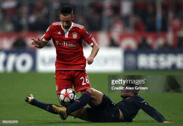Diego Contento of Bayern is tackled by Ederson of Lyon during the UEFA Champions League semi final first leg match between FC Bayern Muenchen and...