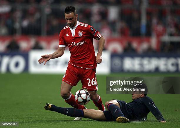 Diego Contento of Bayern is tackled by Ederson of Lyon during the UEFA Champions League semi final first leg match between FC Bayern Muenchen and...