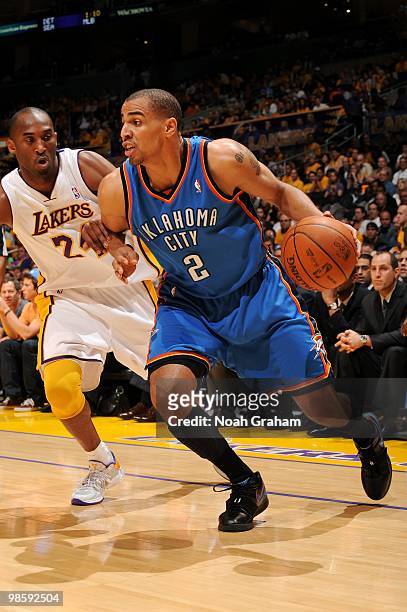 Thabo Sefolosha of the Oklahoma City Thunder makes a move to the basket against Kobe Bryant of the Los Angeles Lakers in Game One of the Western...