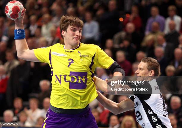 Tobias Reichmann of Kiel battles for the ball with Rico Goede of Berlin during the Toyota Handball Bundesliga match between THW Kiel and Fuechse...