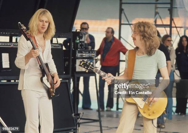 Bassist Tom Hamilton and guitarist Brad Whitford of Aerosmith perform on stage at the RFK Stadium in Washington DC on May 30, 1976.