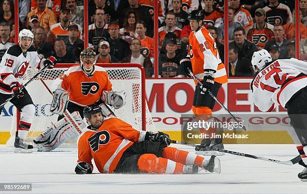 Ian Laperriere of the Philadelphia Flyers attempts to block a shot from Brian Rolston of the New Jersey Devils in Game Four of the Eastern Conference...