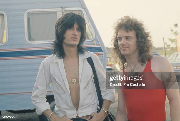 Guitarist Joe Perry and drummer Joey Kramer of Aerosmith off stage in 1976.