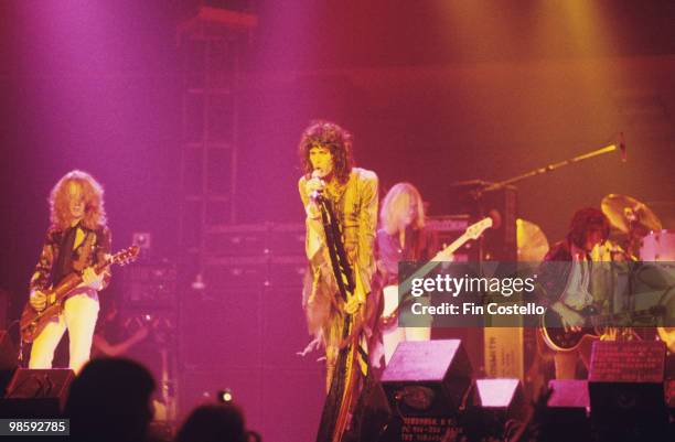 Brad Whitford, Steven Tyler, Tom Hamilton and Joe Perry of Aerosmith perform on stage at the Providence Civic Center in Rhode Island on October 27,...