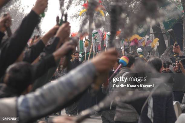 Group of chest beating men carrying chains and drums dressed in black move in south Tehran on The Day of Ashura which is on the 10th day of Muharram...