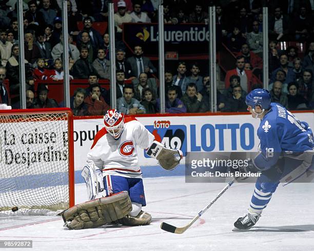 Mike Hough of the Quebec Nordiques scores a goal against the Montreal Canadiens in the late 1980's at the Montreal Forum in Montreal, Quebec, Canada.