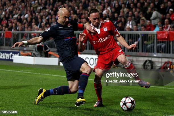 Franck Ribery of Bayern is challenged by Cris of Lyon during the UEFA Champions League semi final first leg match between FC Bayern Muenchen and...