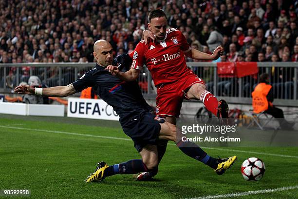 Franck Ribery of Bayern is challenged by Cris of Lyon during the UEFA Champions League semi final first leg match between FC Bayern Muenchen and...