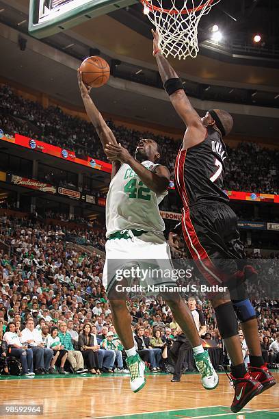 Tony Allen of the Boston Celtics lays up a shot against Jermaine O'Neal of the Miami Heat in Game One of the Eastern Conference Quarterfinals during...