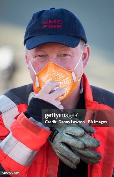 Firefighters arrive to tackle the wildfire on Saddleworth Moor, which continues to burn as firefighters try to quell multiple pockets of flames...