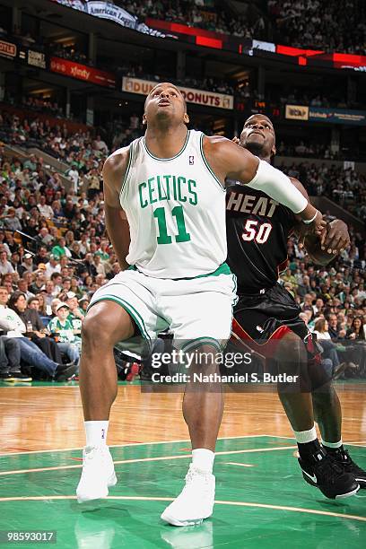Glen Davis of the Boston Celtics rebounds against Joel Anthony of the Miami Heat in Game One of the Eastern Conference Quarterfinals during the 2010...