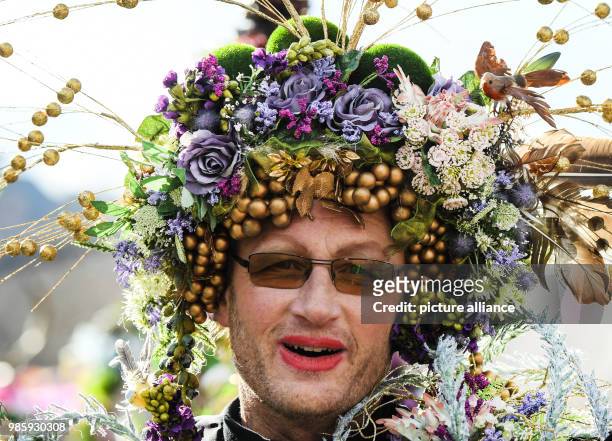 Jester wearing a fancy headdress takes part in the Rosenmontag carnival procession in Mainz, Germany, 12 Febraury 2018. The 'Rosenmontagsumzug' is...