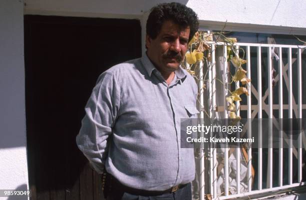 Muhammad Zaydan or better known as Abu Abbas carrying a pistol in his residence courtyard in Baghdad, Iraq during 1991 Gulf War. He was born on...