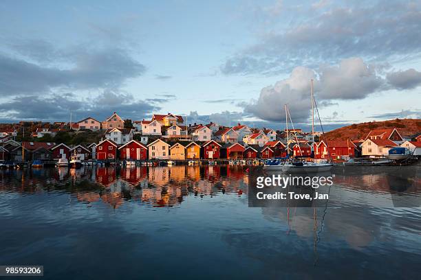 houses by the sea at sunset, sweden. - västra götaland county bildbanksfoton och bilder