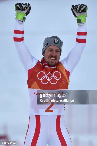 Winner Marcel Hirscher from Austria celebrates his performance at the men's combined slalom at Jeongseon Alpine Centre in Pyeongchnag, South Korea,...