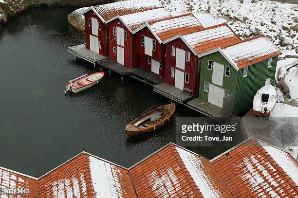 boathouses with snowy roofs, sweden. - västra götaland county bildbanksfoton och bilder