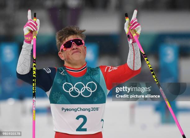 Johannes Hoesflot Klaebo from Norway celebrates his victory at the men's cross-country skiing classic sprint at the Alpensia Centre in Pyeongchang,...