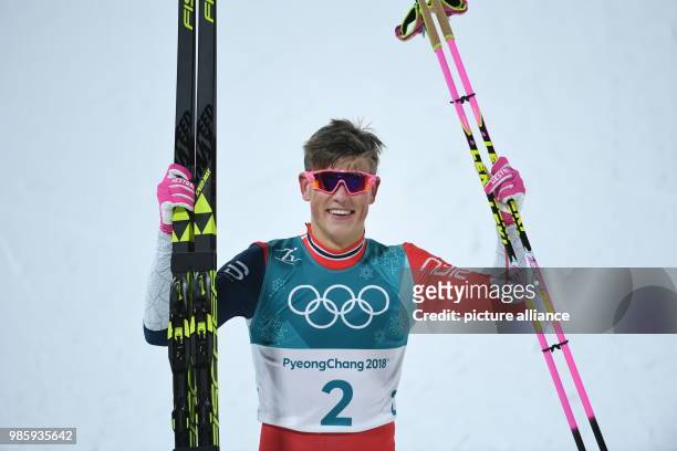 Johannes Hoesflot Klaebo from Norway celebrates his victory at the men's cross-country skiing classic sprint at the Alpensia Centre in Pyeongchang,...