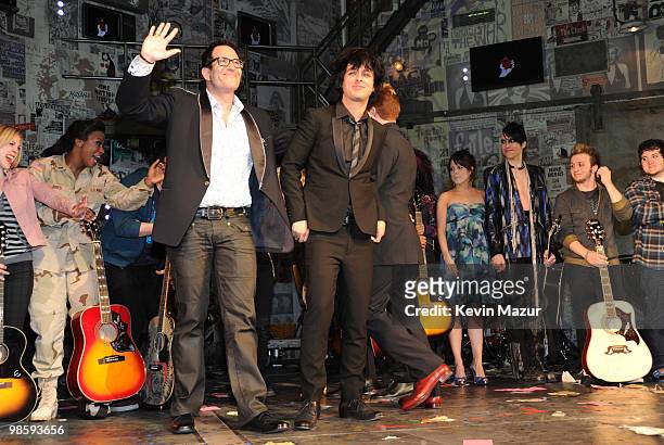 Director Michael Mayer, Billie Joe Armstrong, Tre Cool and Mike Dirnt of Green Day and the cast of "American Idiot" during the curtain call for the...