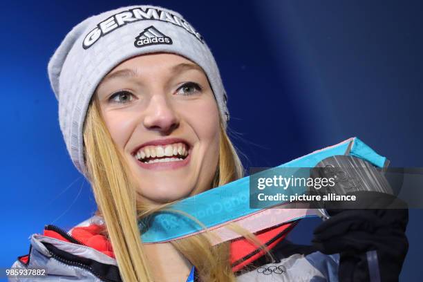 Dpatop - German silver medallist Katharina Althaus holds her medal during the award ceremony of the Women's Normal Hill Individual Ski Jumping...