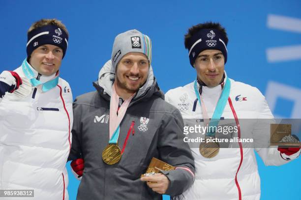 Dpatop - French silver medallist Alexis Pinturault , Austrian gold medallist Marcel Hirscher and French bronze medallist Victor Muffat-Jeandet...